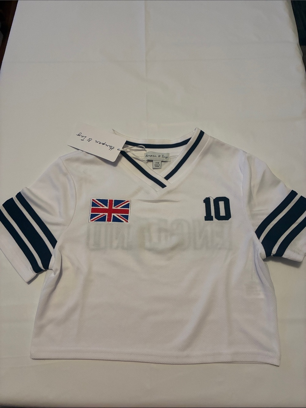 White Kids V-Neck Jersey Tee with Navy Trim and Union Jack Patch